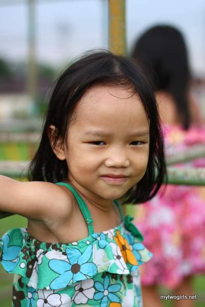 Zaria playing on monkey bars
